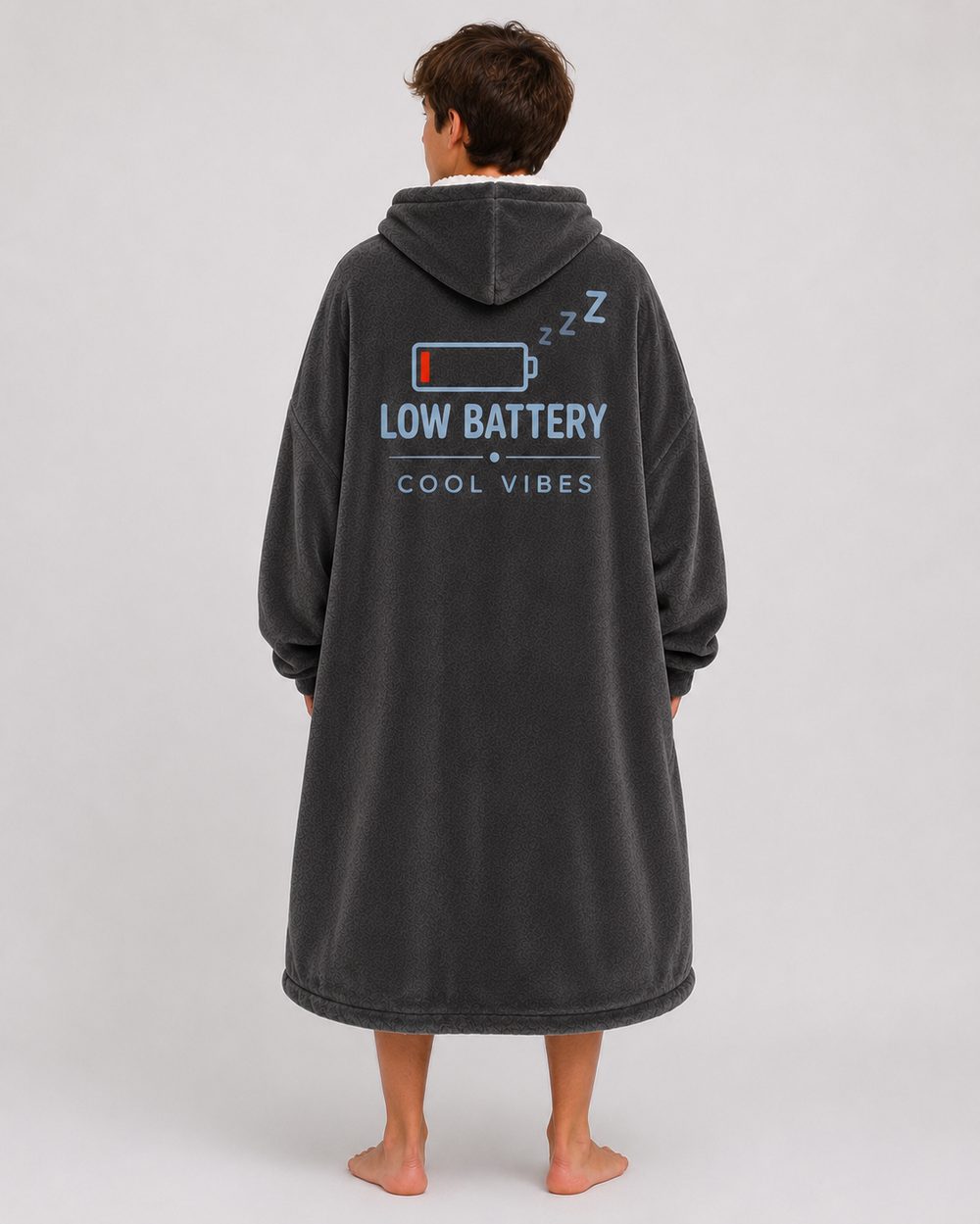 The back of the hoodie blanket showing the full Low Battery artwork with three Z characters across the upper back.
